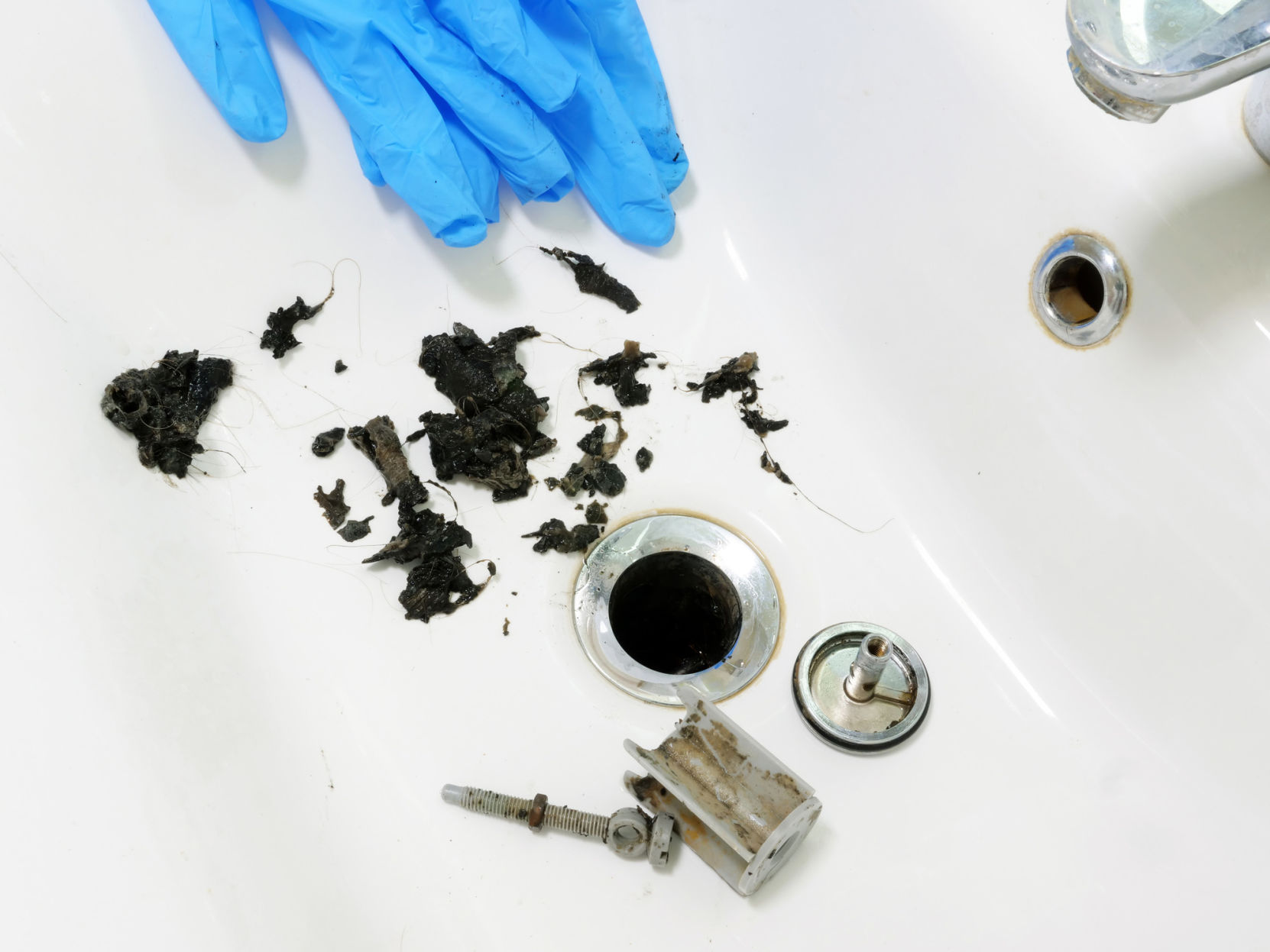 Unclogging a drain